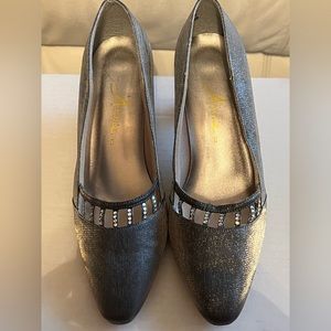 Sparkly silver high heeled pumps, trimmed with rhinestones. Size 7 1/2.